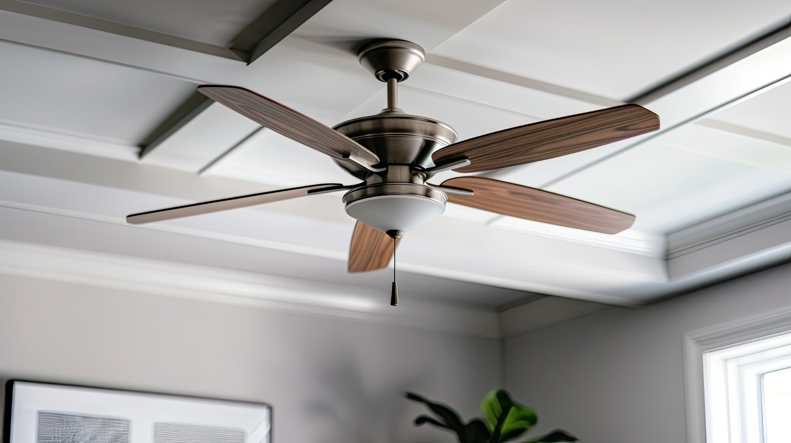 Ceiling fan installed in a bright room